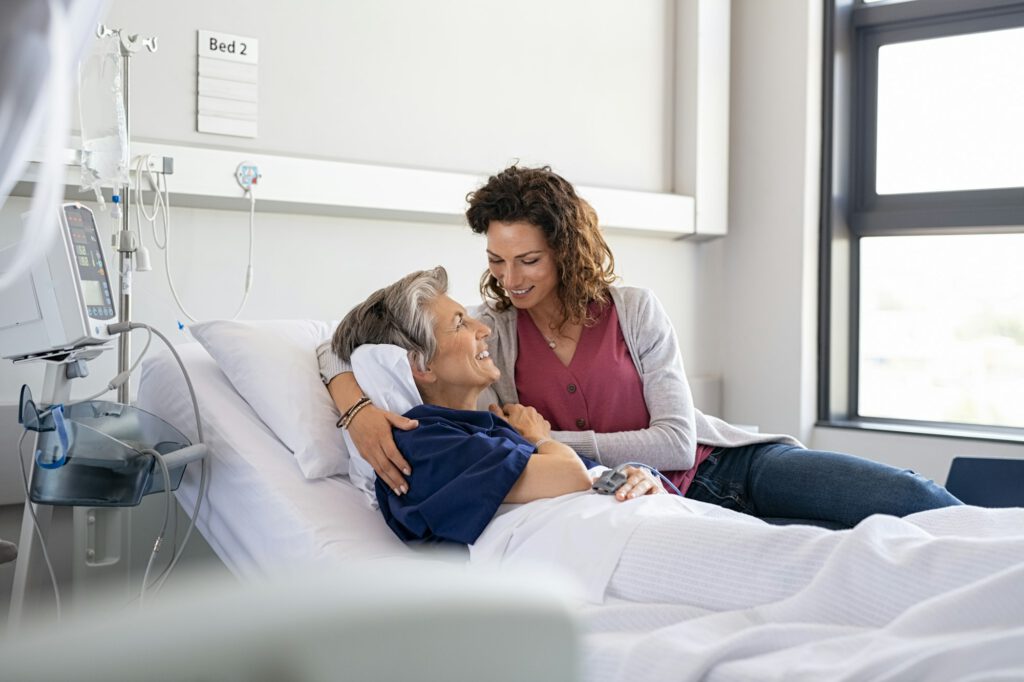 Daughter visiting mother in hospital