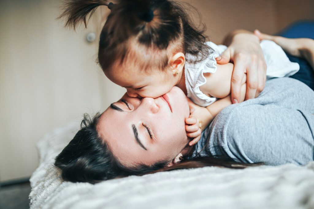 Lifestyle photo of mother and daughter at home